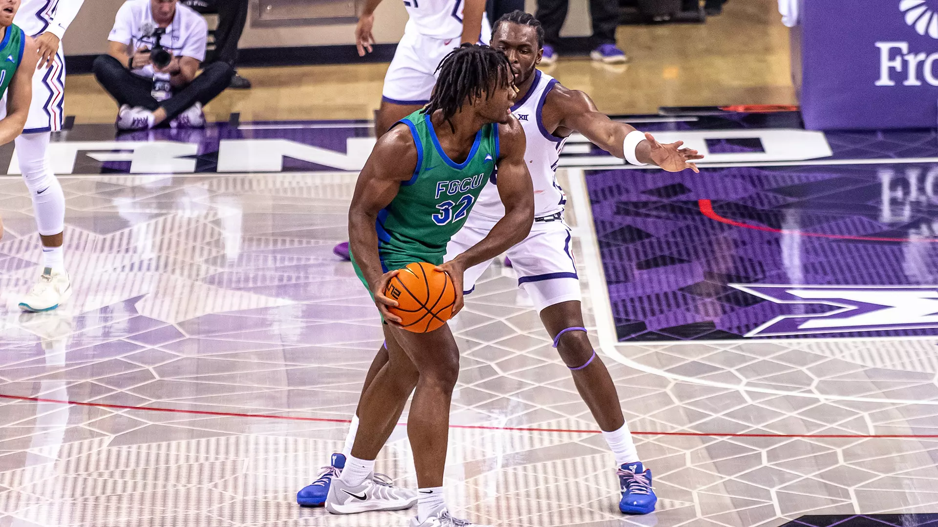 Keeshawn Kellman posts up with the ball against a defender during an SCBL basketball game, showing the youth development focus across the Lehigh Valley.